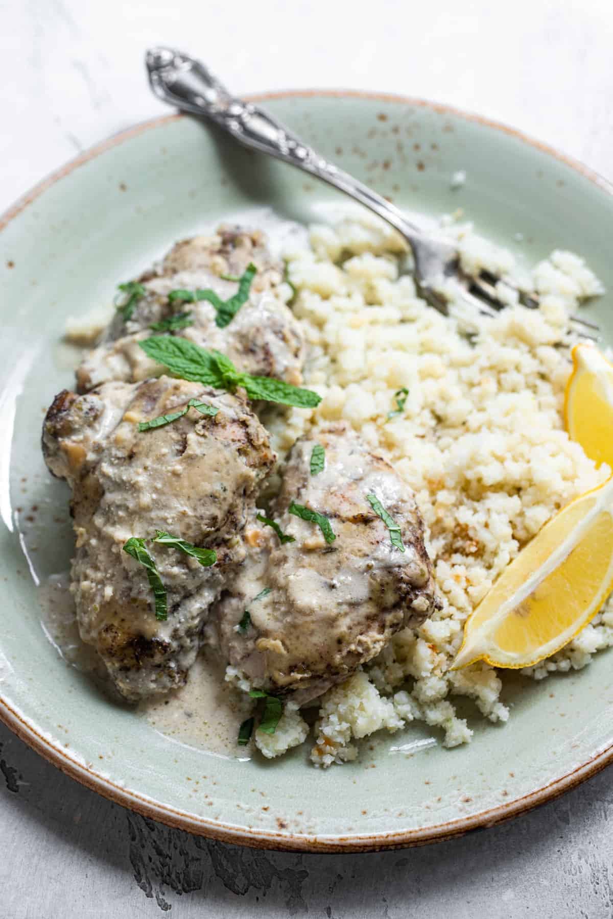 keto chicken thighs on a plate with rice