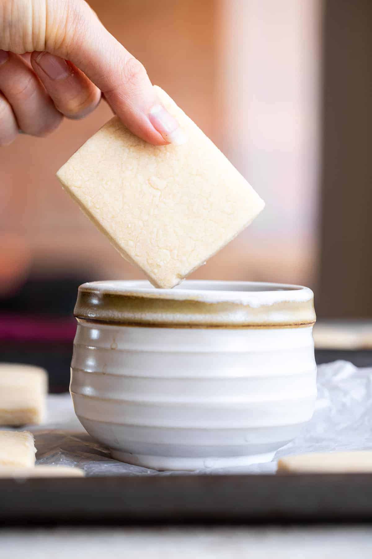 Dairy Free Vegan Shortbread Cookies - Crunchy, buttery but naturally dairy free and only 3 ingredients! Perfect for Christmas! | #Foodfaithfitness | #dairyfree #eggfree #nutfree #vegan #shortbread Vegan butter cookies being dipped into a cup of coffee
