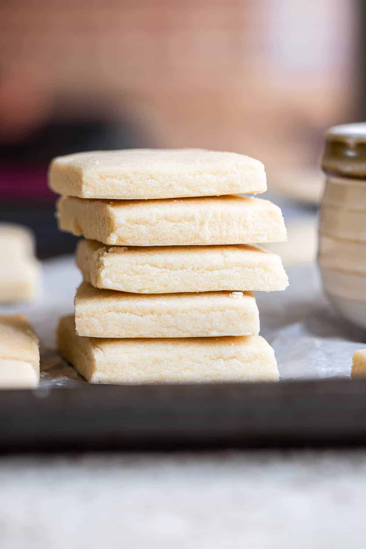 Dairy Free Vegan Shortbread Cookies - Crunchy, buttery but naturally dairy free and only 3 ingredients! Perfect for Christmas! | #Foodfaithfitness | #dairyfree #eggfree #nutfree #vegan #shortbread a stack of dairy free vegan shortbread cookies