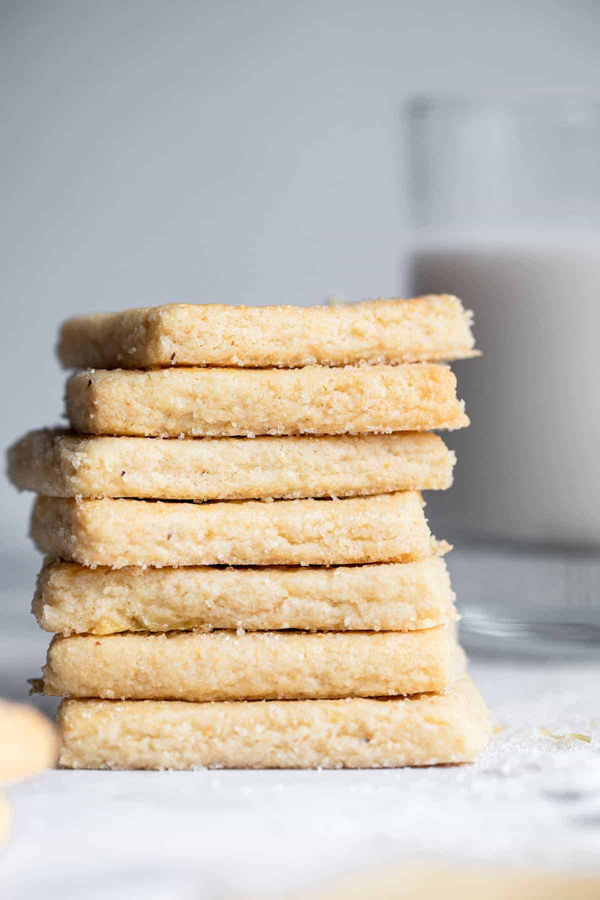 Gluten Free Almond Flour Shortbread Cookies - Only 6 simple ingredients and melt in your mouth! Naturally gluten free, delicious and perfect for the holidays! | #Foodfaithfitness | #Glutenfree #christmas #shortbread #healthy a stack of gluten free almond flour shortbread cookies