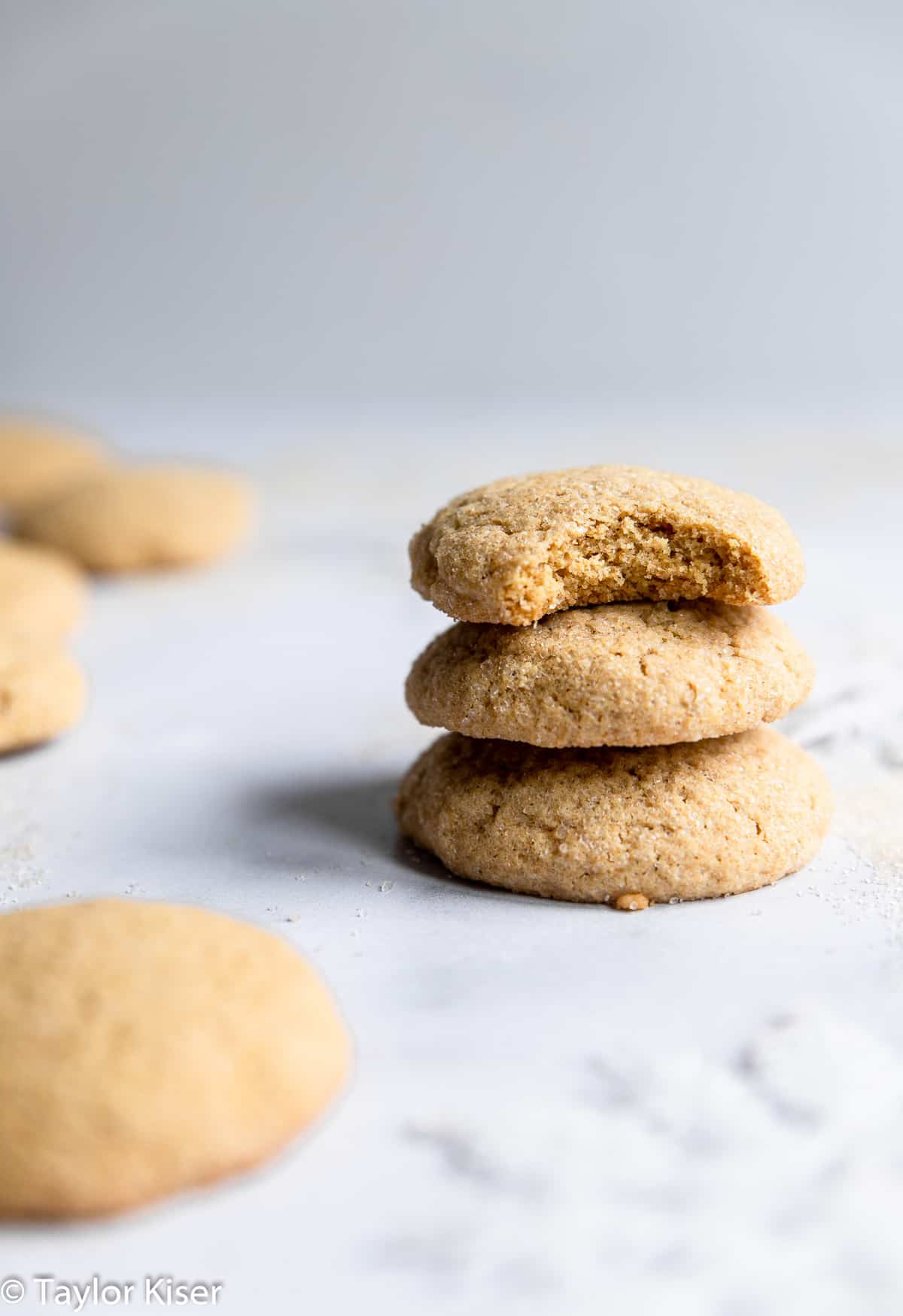 Low Sugar Healthy Sugar Cookies - These Low Sugar Healthy Sugar Cookies are so soft and chewy you would never believe they're whole grain and have very minimal sugar! | #Foodfaithfitness | #Healthy #cookies #Christmas #wholewheat #sugarcookies  a stack of low sugar healthy sugar cookies on a table