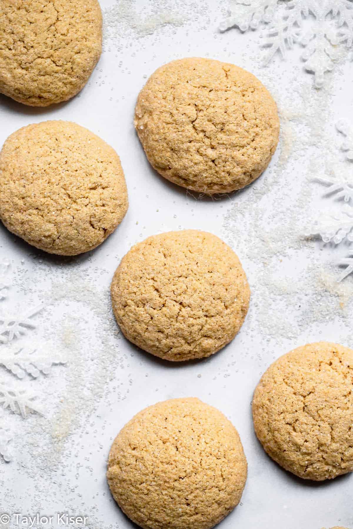 Low Sugar Healthy Sugar Cookies - These Low Sugar Healthy Sugar Cookies are so soft and chewy you would never believe they're whole grain and have very minimal sugar! | #Foodfaithfitness | #Healthy #cookies #Christmas #wholewheat #sugarcookies  close up on healthy sugar cookies overhead on a table