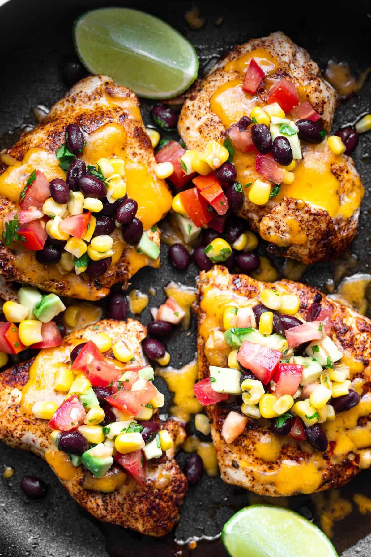 Santa Fe Chicken - This Santa Fe Chicken is an easy, weeknight dinner that is naturally gluten free and healthy! This will please even the pickiest of eaters! | #Foodfaithfitness | #glutenfree #healthy #dinner #chickendinner #kidfriendly black bean salsa chicken in a skillet covered with cheese