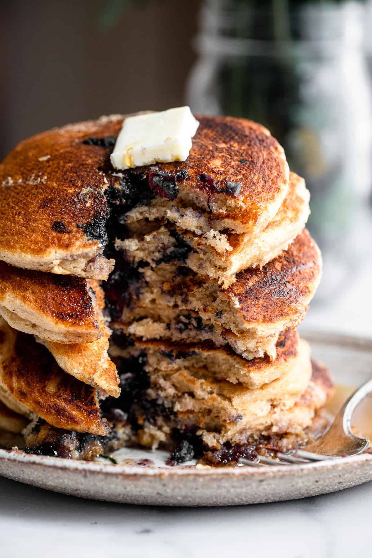 Healthy Blueberry Kefir Pancakes - These blueberry pancakes are SO fluffy and delicious you will never know they are whole grain, healthy and egg free! Great for a filling breakfast! | #Foodfaithfitness | #healthy #pancakes #wholewheat #eggfree Blueberry Kefir Pancakes