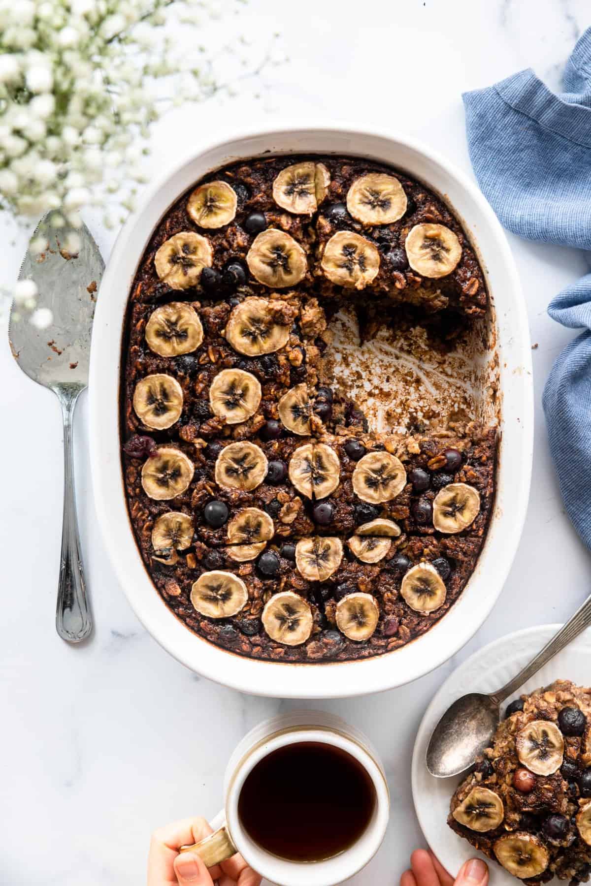 Blueberry baked oatmeal recipe ready to be eaten with a spoon on a table
