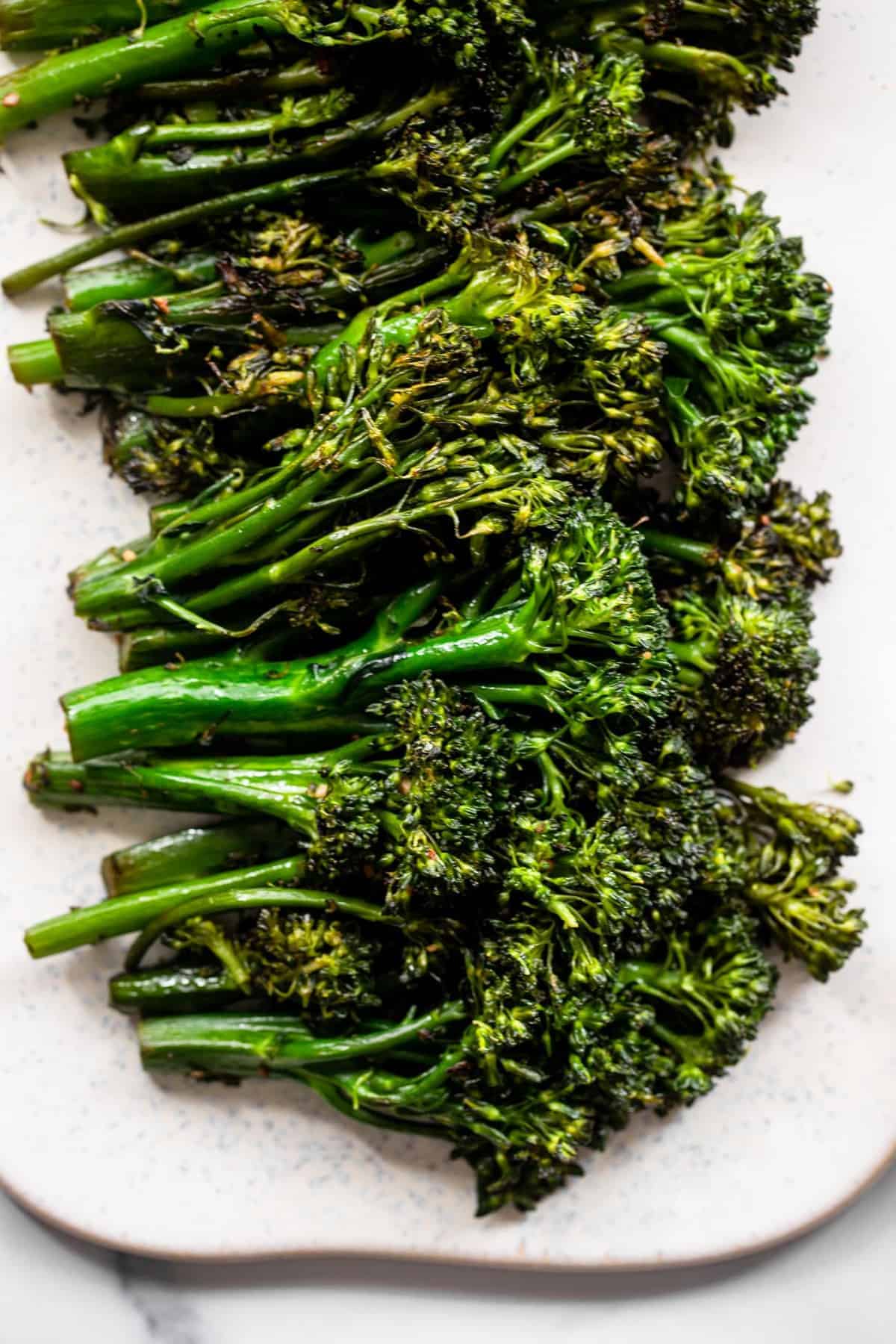Sautéed broccoli close up on a board