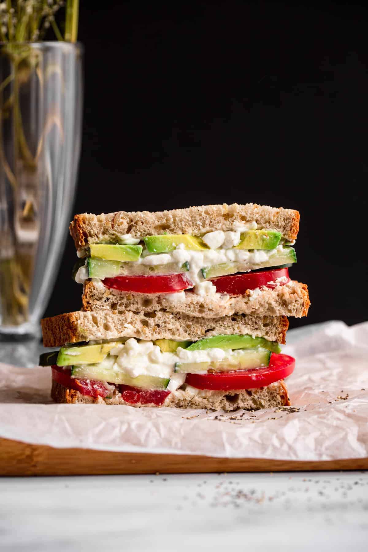 Â This Cottage Cheese Sandwich is a healthy and protein packed lunch for kids or adults! It will keep you full until dinner and is so easy to make! | #Foodfaithfitness | #glutenfree #healthy #cottagecheese #kidfriendly cottage cheese sandwich on a cutting board