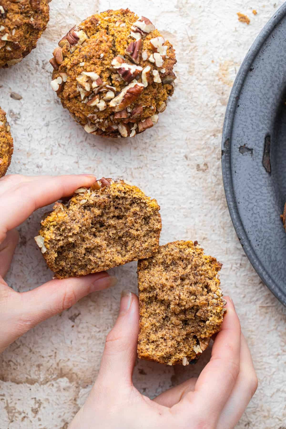 These Keto Pumpkin Muffins are made with almond flour and are so moist and fluffy you won't believe they're low carb and healthy! | #Foodfaithfitness | #Keto #lowcarb #glutenfree #sugarfree #paleo keto pumpkin muffins cut open showing the inside