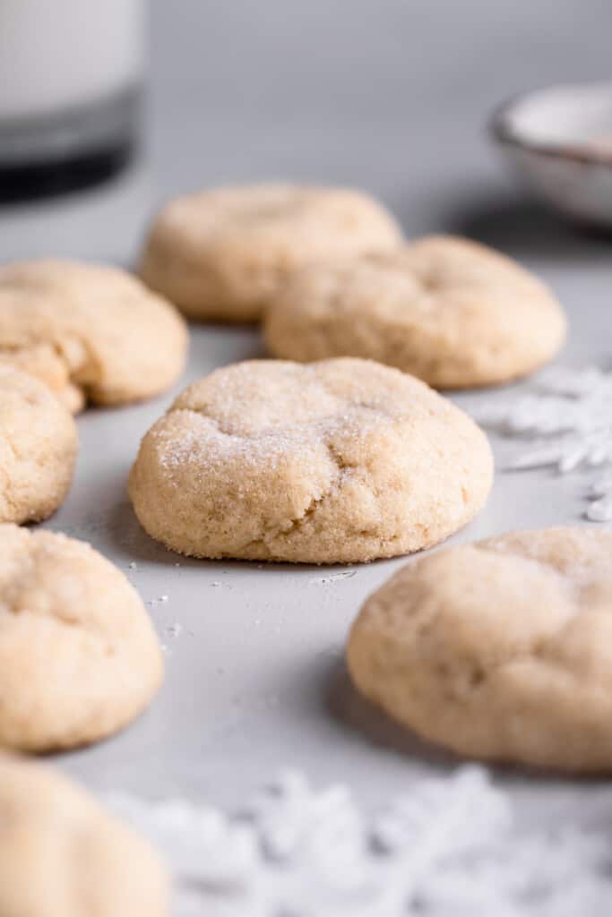 close view of Eggless Sugar Cookies with paper snowflakes around it