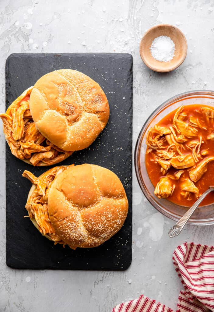 two Instant Pot Buffalo Chicken burgers on a slab