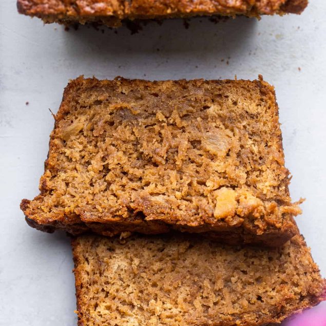a loaf of Banana Pineapple Bread with slices cut off