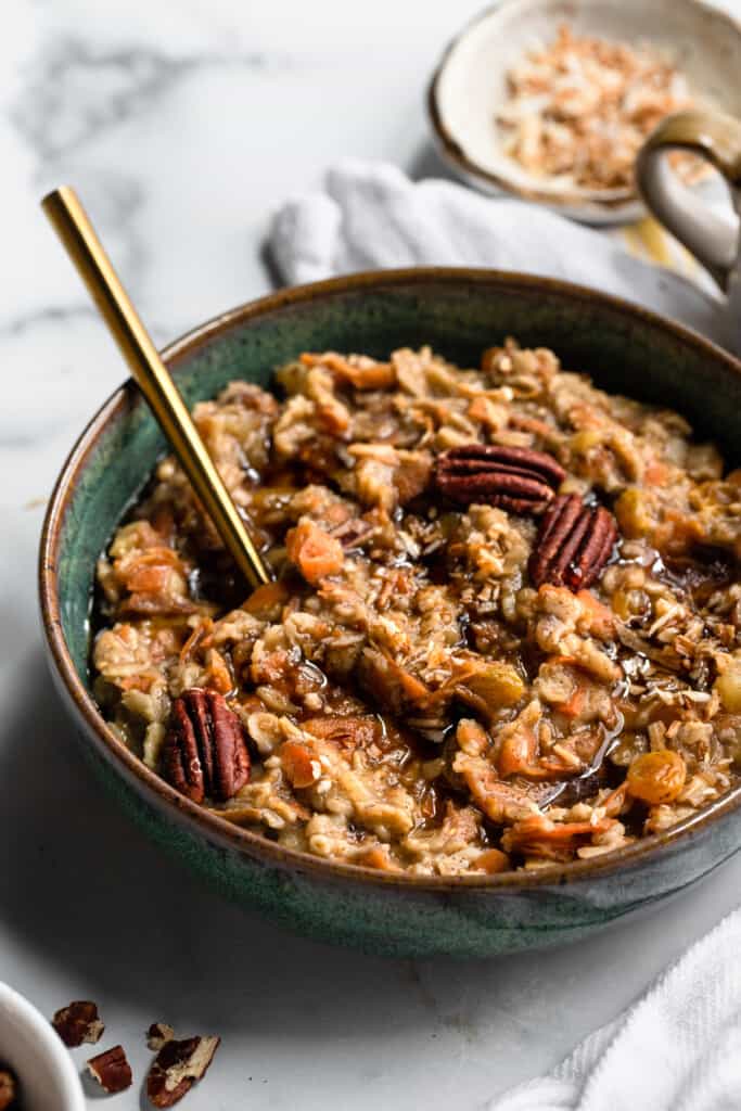a bowl of Carrot Cake Oatmeal with a spoon in it