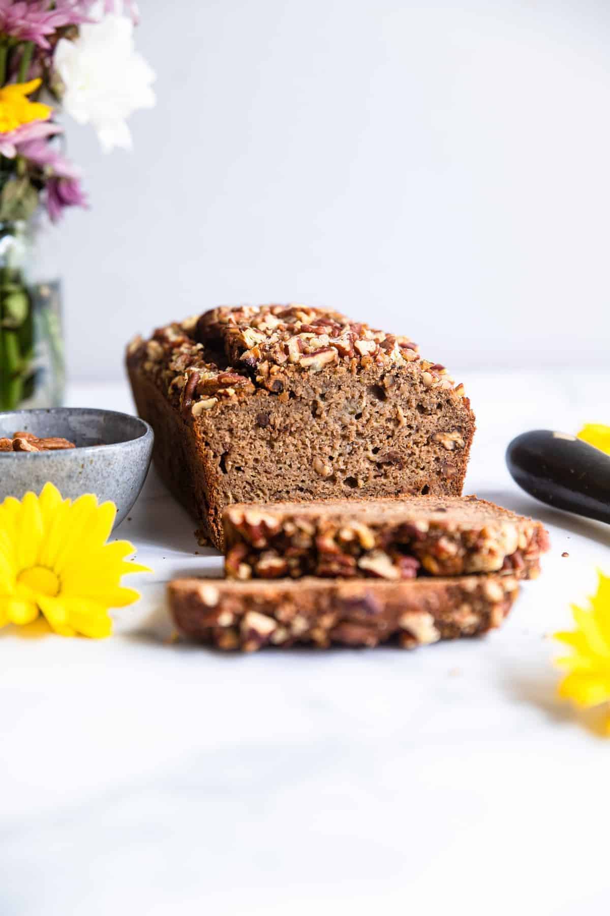 Sugar free banana bread sliced and sitting on a table