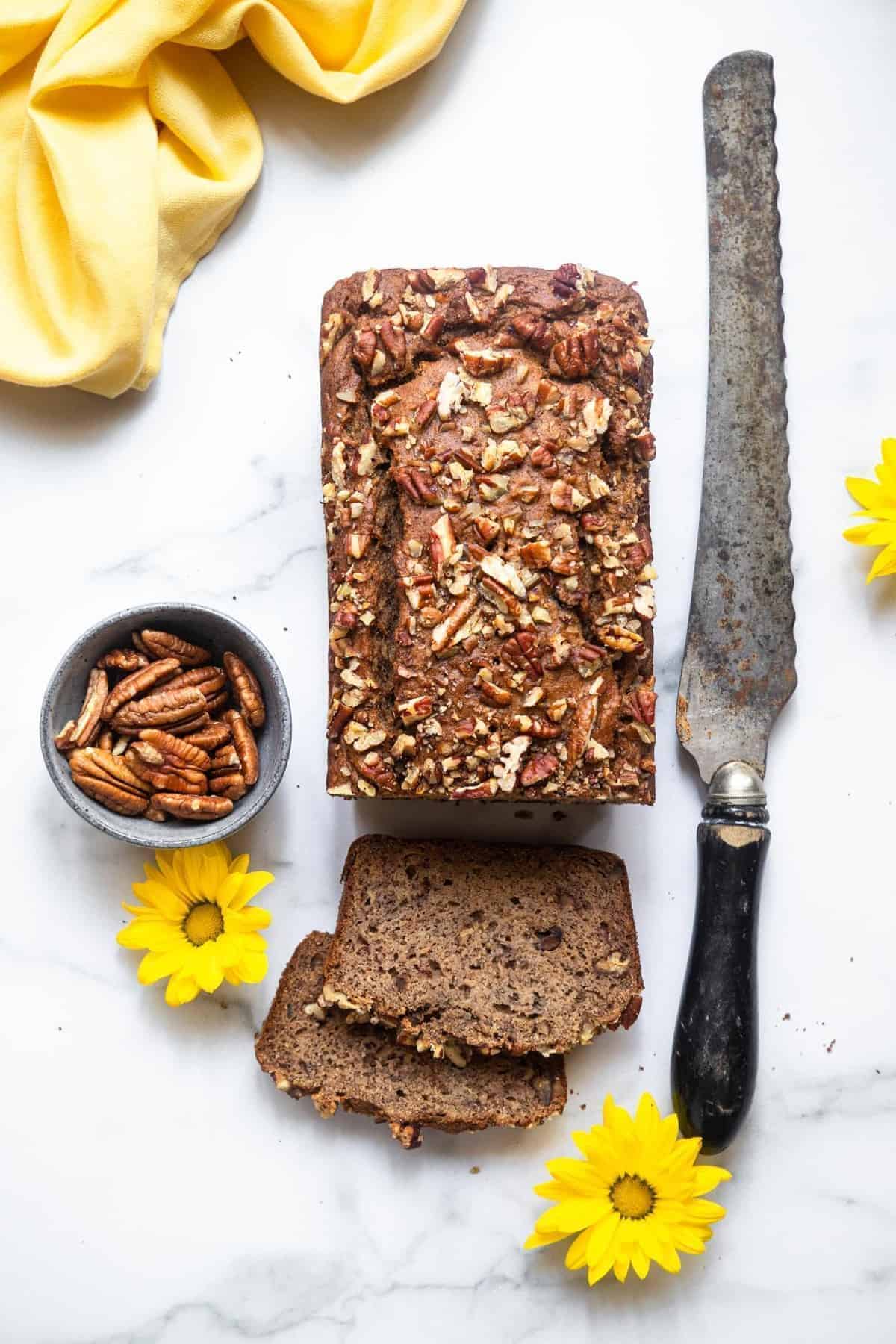 over head photo of a Sugarless banana bread on a table top