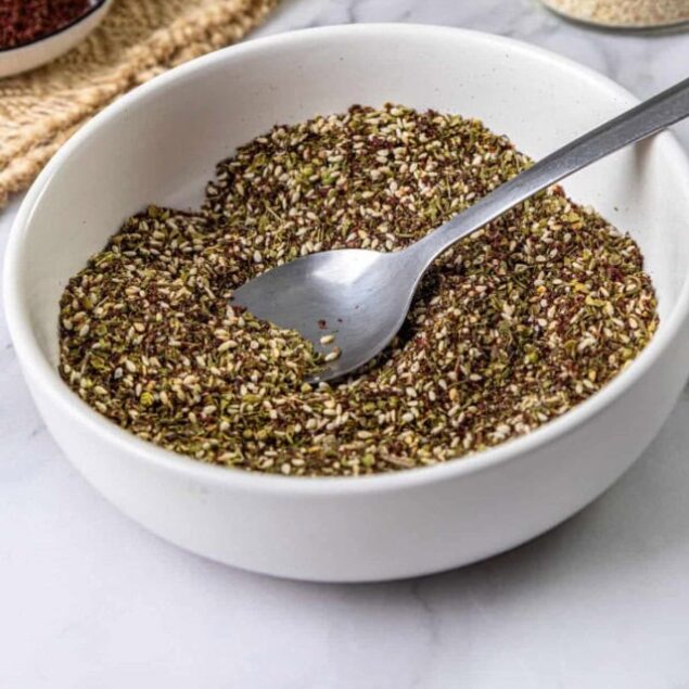 Ground hemp seeds in a white bowl, ready to add to healthy recipes or smoothies. A nutritious, plant-based superfood rich in omega-3s, fiber, and protein, ideal for a balanced diet.