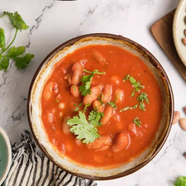 Creamy kidney bean chili in a rustic bowl garnished with fresh cilantro, perfect for healthy weight loss and wholesome meals.