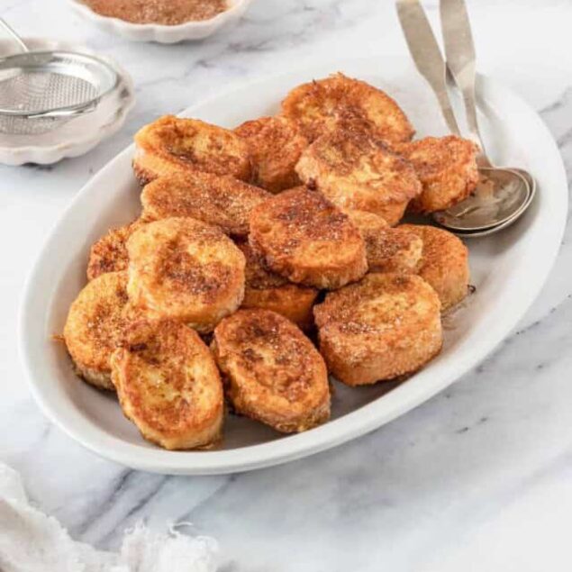 Golden crispy chicken nuggets served on a white platter with dipping sauces, perfect for healthy snacks, easy meals, and family dinners.