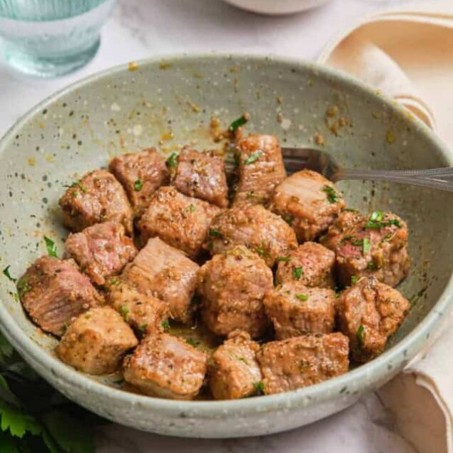 Tender, flavorful meatballs with herbs served in a rustic bowl, perfect for healthy meals and meal prep. Ideal for those seeking nutritious, protein-packed dishes from Food Faith Fitness.