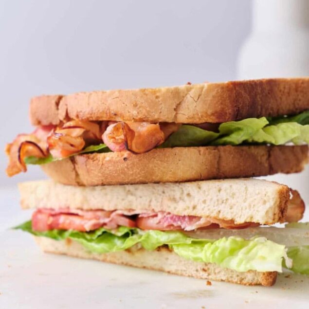 Fresh homemade sandwiches featuring whole grain bread, crispy bacon, fresh lettuce, and tomato, highlighting healthy, easy-to-make meal ideas for a balanced diet.