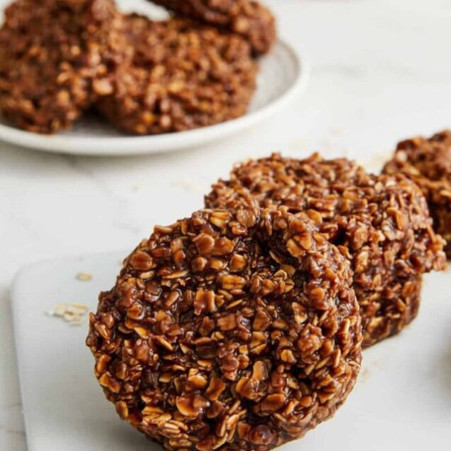 Rich chocolate peanut butter energy bites covered in chopped nuts, perfect for healthy snacking and fitness fueling. Delicious, easy-to-make, and packed with wholesome ingredients.