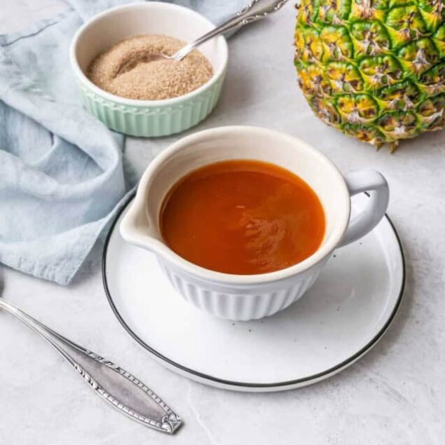 Cream of pineapple soup with sugar and fresh pineapple on a white plate, healthy tropical fruit dessert, vegan and gluten-free snack, food faith fitness recipe.