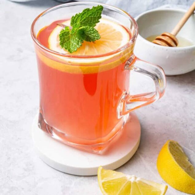 Refreshing citrus iced tea garnished with lemon and mint, perfect for healthy hydration. Bright, flavorful, and low-calorie drink recipe ideal for a balanced diet.