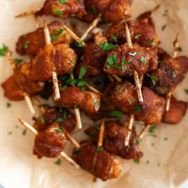Savory grilled chicken skewers with spices, garnished with fresh herbs, perfect for healthy eating and meal prepping. Ideal for quick snacks and family dinners.