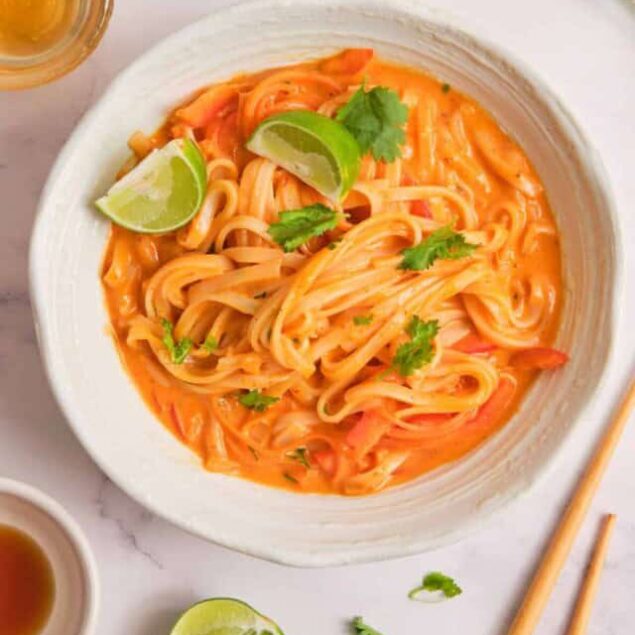 Creamy Thai-inspired salmon pasta with lime, cilantro, and a flavorful spicy tomato sauce. A nutritious and delicious seafood pasta dish perfect for healthy eating.