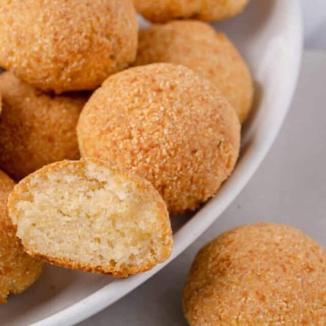 Golden baked chicken nuggets on a white dish, crispy textured exterior, soft inside, perfect for healthy snack options.