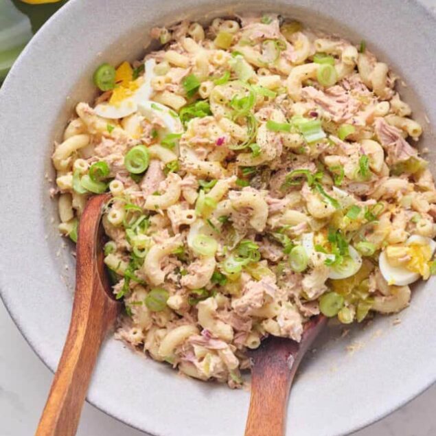 Creamy tuna pasta salad with fresh green onions and boiled eggs, a healthy and protein-packed meal perfect for quick lunches or light dinners.