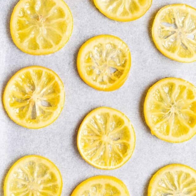 Lemon slices on a gray background, fresh and vibrant, ideal for healthy food recipes and wellness tips.