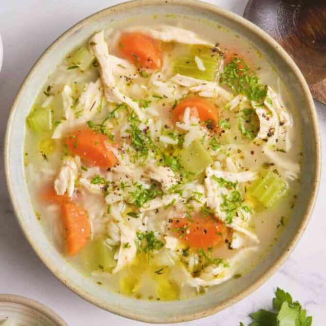 Creamy chicken and vegetable soup with carrots, celery, and herbs, perfect for health-conscious eating and home-cooked meals.