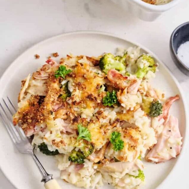 Creamy cauliflower casserole with broccoli, cheese, and crispy topping, healthy comfort food, high-protein low-carb dish, perfect for nutritious family dinners.
