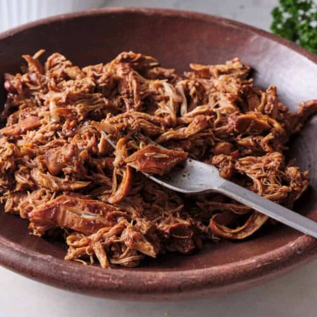 Tender shredded beef in a rustic bowl, perfect for healthy meal prep and family dinners. Easy shredded beef recipe that is both flavorful and nutritious.
