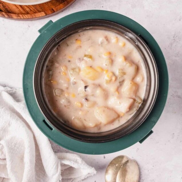 Creamy corn chowder with fresh vegetables and herbs, perfect for healthy comfort food recipes. Easy to make in an instant pot or stovetop, ideal for a nutritious meal.