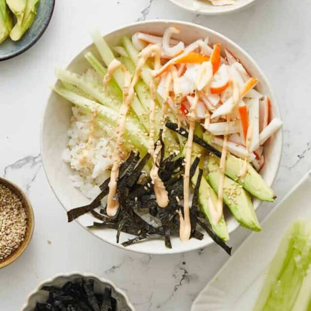 Fresh vegetable poke bowl with cucumber, shredded crab sticks, seaweed, and sesame seeds – a healthy, protein-packed meal for weight loss and fitness.