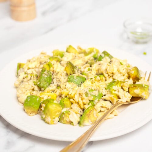 Scrambled eggs with chopped green bell peppers on a white plate, healthy breakfast, high protein, low carb, nutrient-rich meal, fresh food for fitness and wellness, food faith fitness recipe.