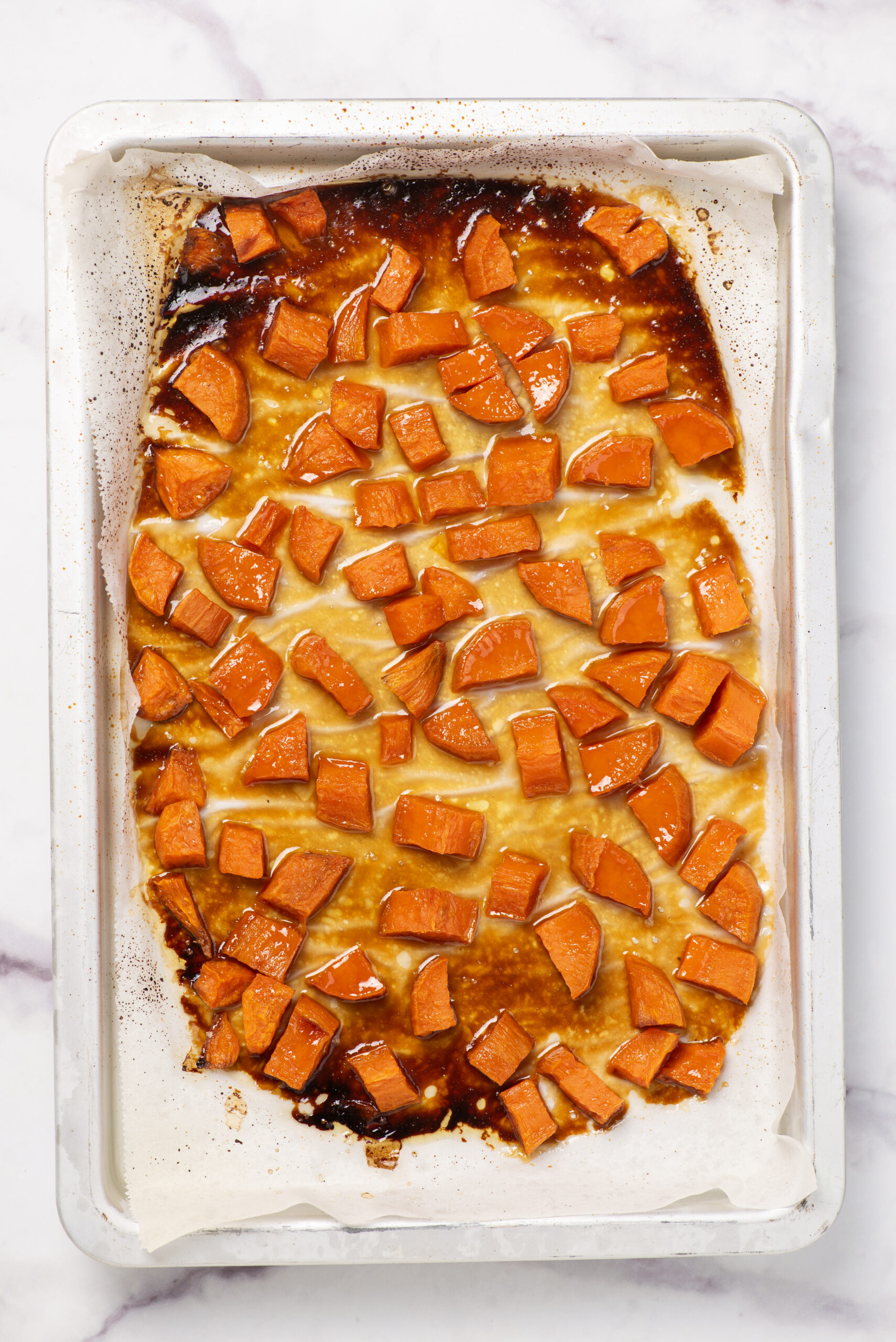 Roasted sweet potato casserole with caramelized topping in a baking dish, healthy and delicious food recipe from Food Faith Fitness.