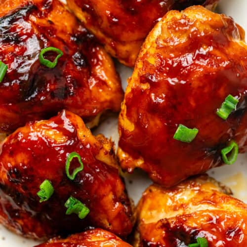 Juicy baked chicken wings coated in barbecue sauce with chopped green onions, perfect for healthy meal options and flavorful recipes.