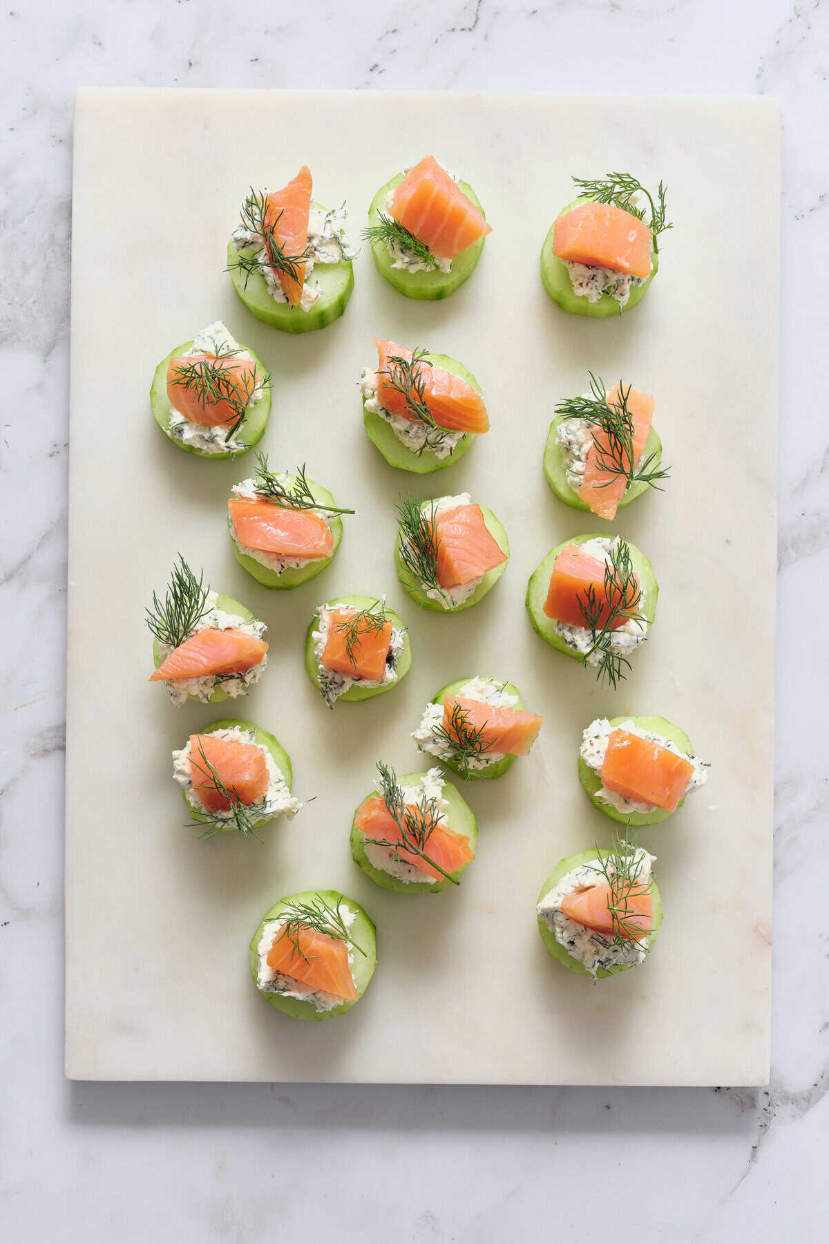 Smoked salmon cucumber bites with cream cheese and dill, healthy appetizer for weight loss and clean eating, perfect keto snack, gluten-free, easy to prepare for parties or healthy meals.