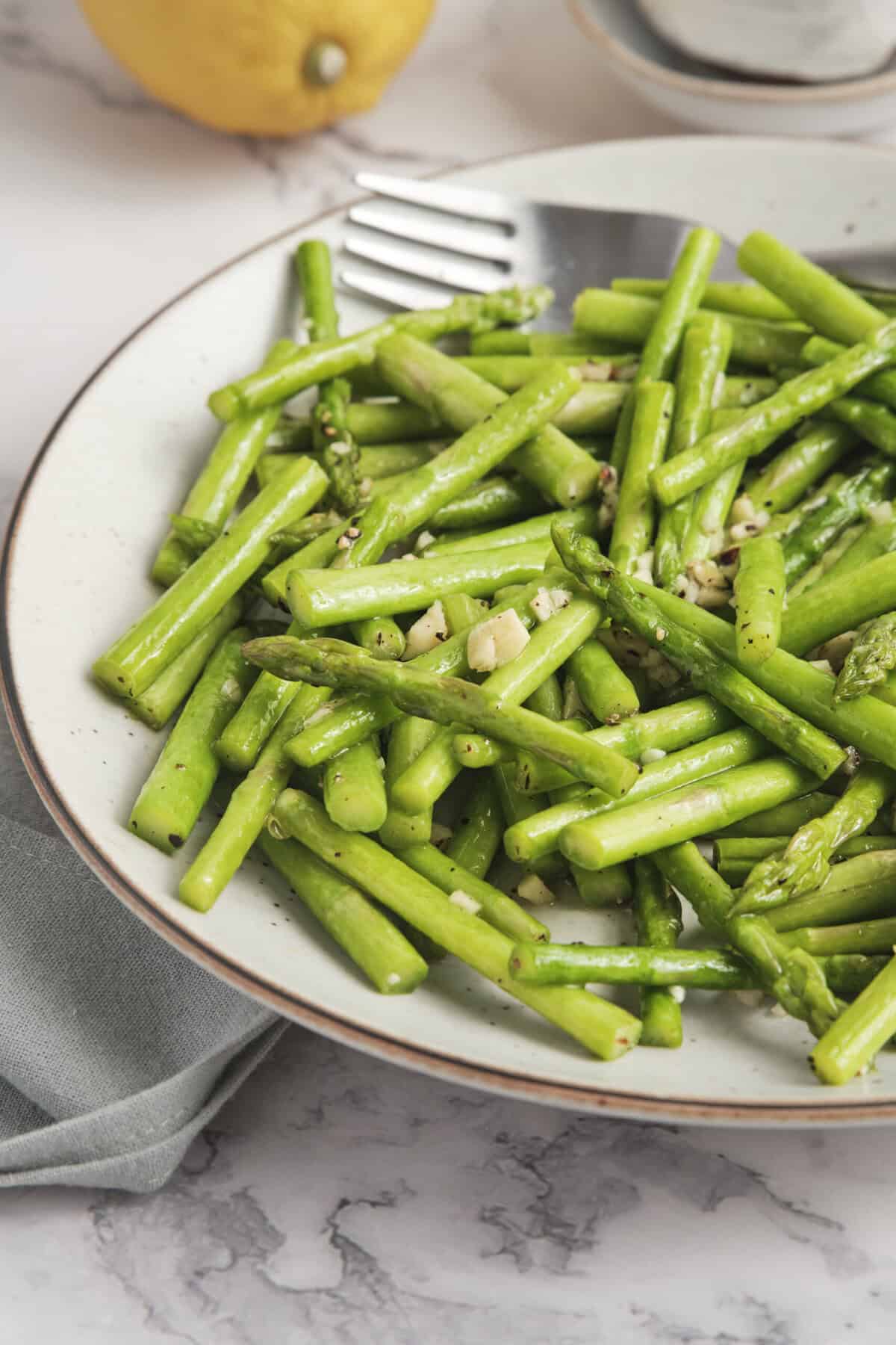 Roasted asparagus with garlic and seasoning for a healthy plant-based meal.