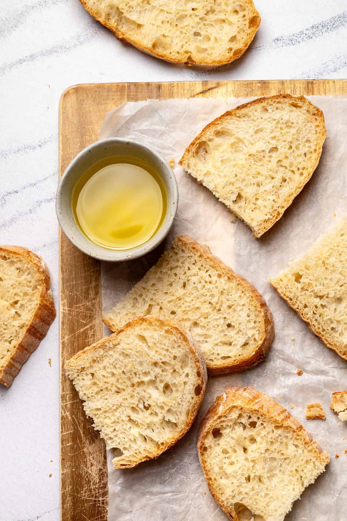 Buttery bread slices with olive oil, fresh baked bread, healthy bread options, food photography, clean eating, nutritious snacks, homemade bread, gluten-free choices, tasty bread recipes, foodie lifestyle, wholesome eating, bakery fresh bread.