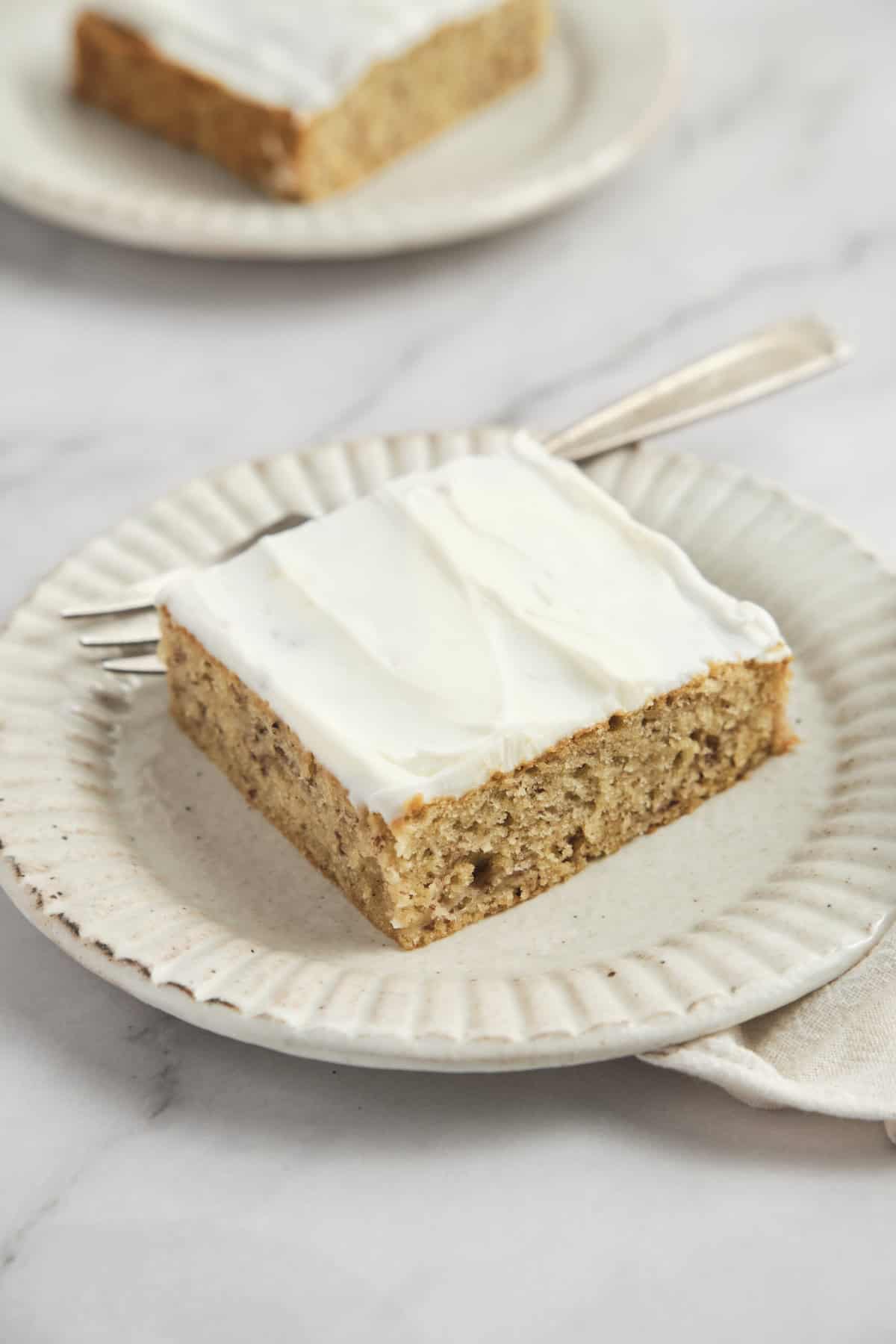 Smetana cheese carrot cake bar on white ceramic plate with cream of cream cheese, gluten -free, healthy dessert, best home recipe for carrot cake, nutritious snacks, fitness faith.