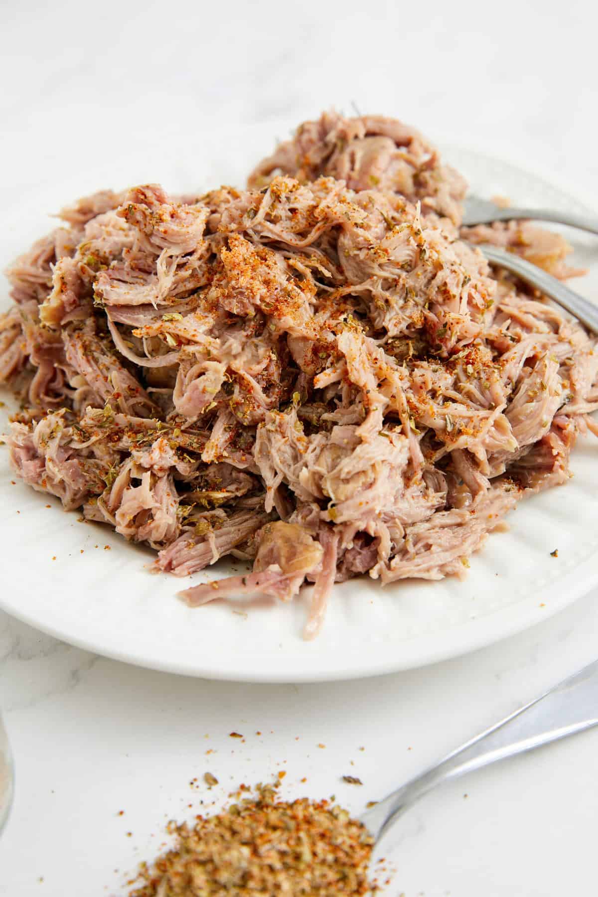 Juicy shredded chicken breast with herbs and spices, perfect for healthy meal prep or protein-packed recipes. A flavorful, tender, and nutritious chicken dish for weight loss and fitness goals.