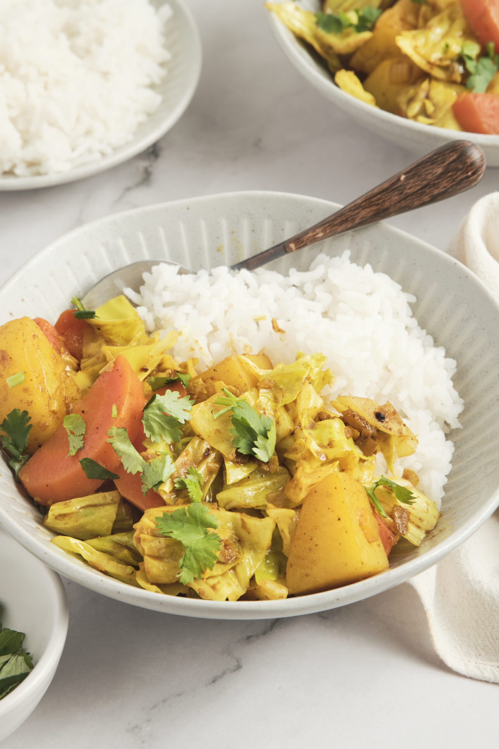 Steamed vegetables with rice in a white bowl, healthy plant-based meal option, fresh ingredients, nutritious, vegetarian, gluten-free, high fiber, delicious, balanced diet, food styling.