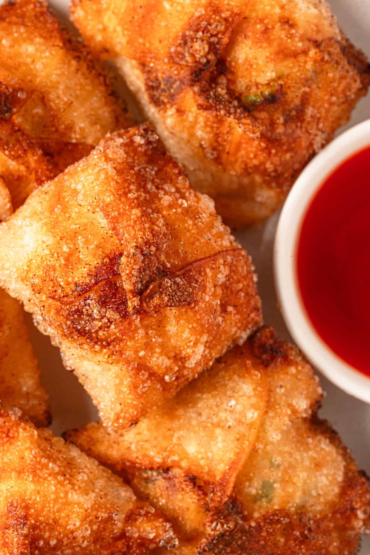 Crispy baked chicken wings with a golden, seasoned coating served with a side of buffalo hot sauce for a healthy, protein-packed meal or snack option.