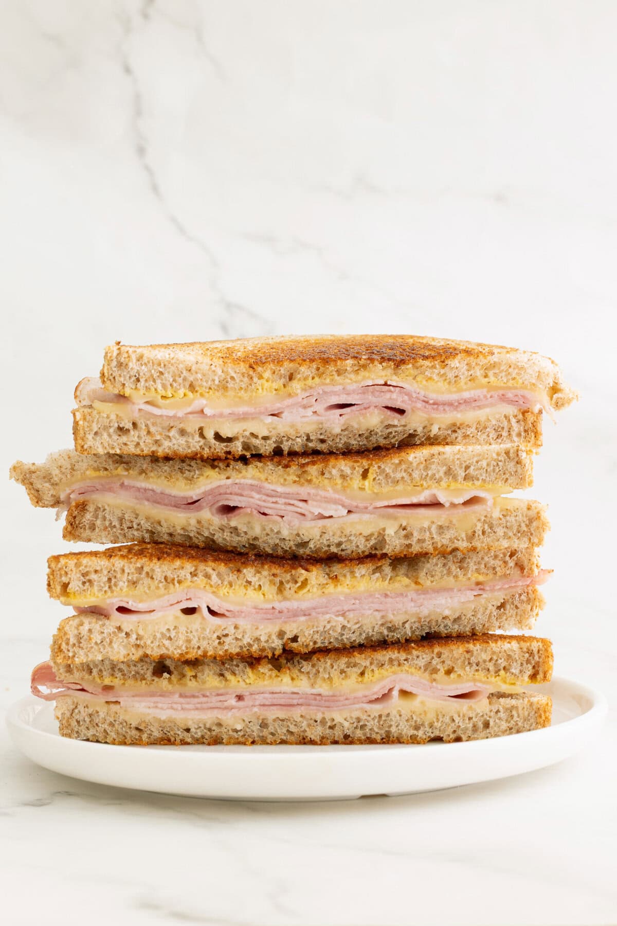 A healthy sandwich with ham and whole grain bread cheese, ideal for lunch nutritional ideas and balanced food recipes.