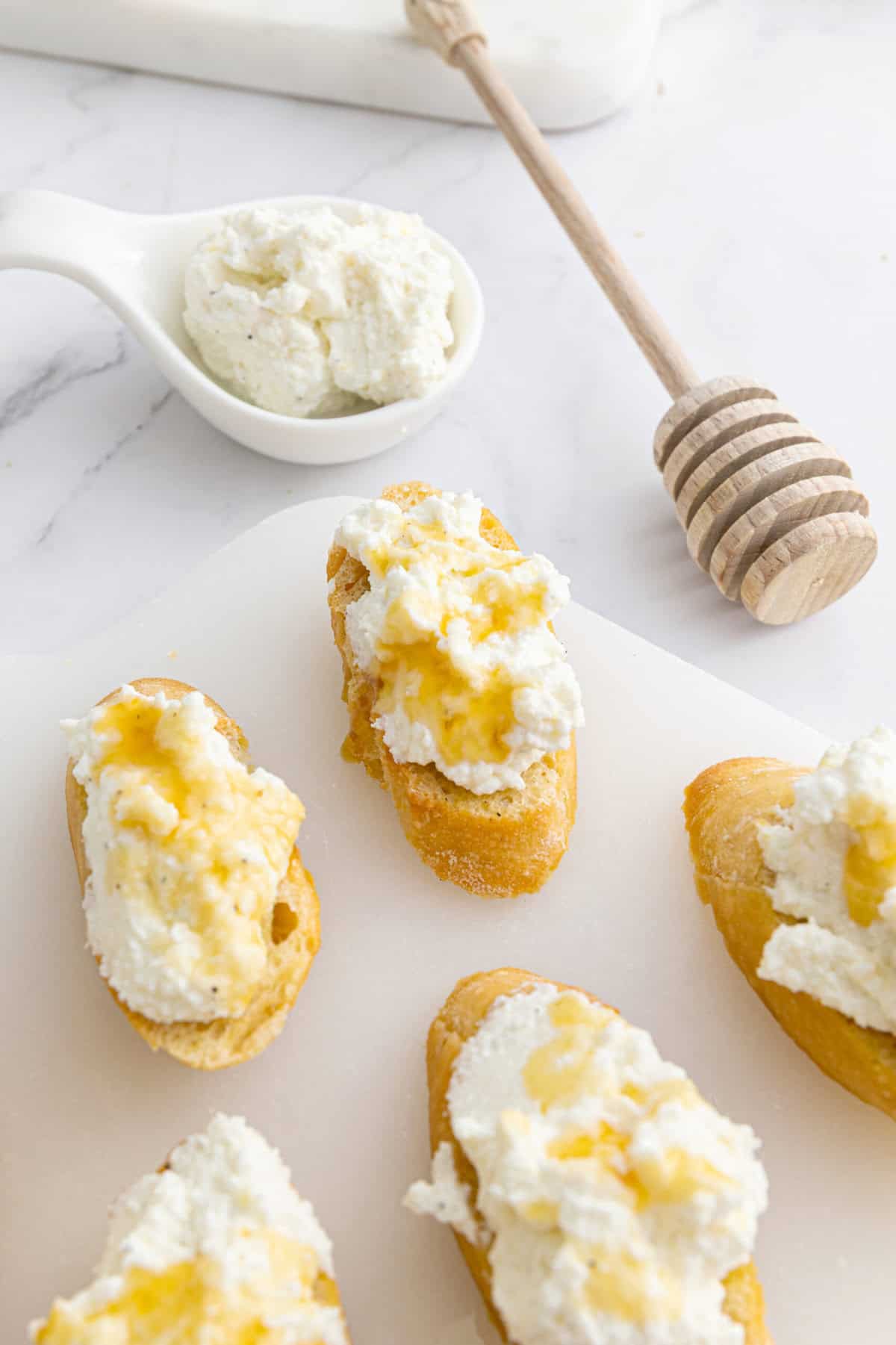 Creamy ricotta topping on healthy banana bread slices with honey drizzle, perfect for nutritious snacking and meal prep.