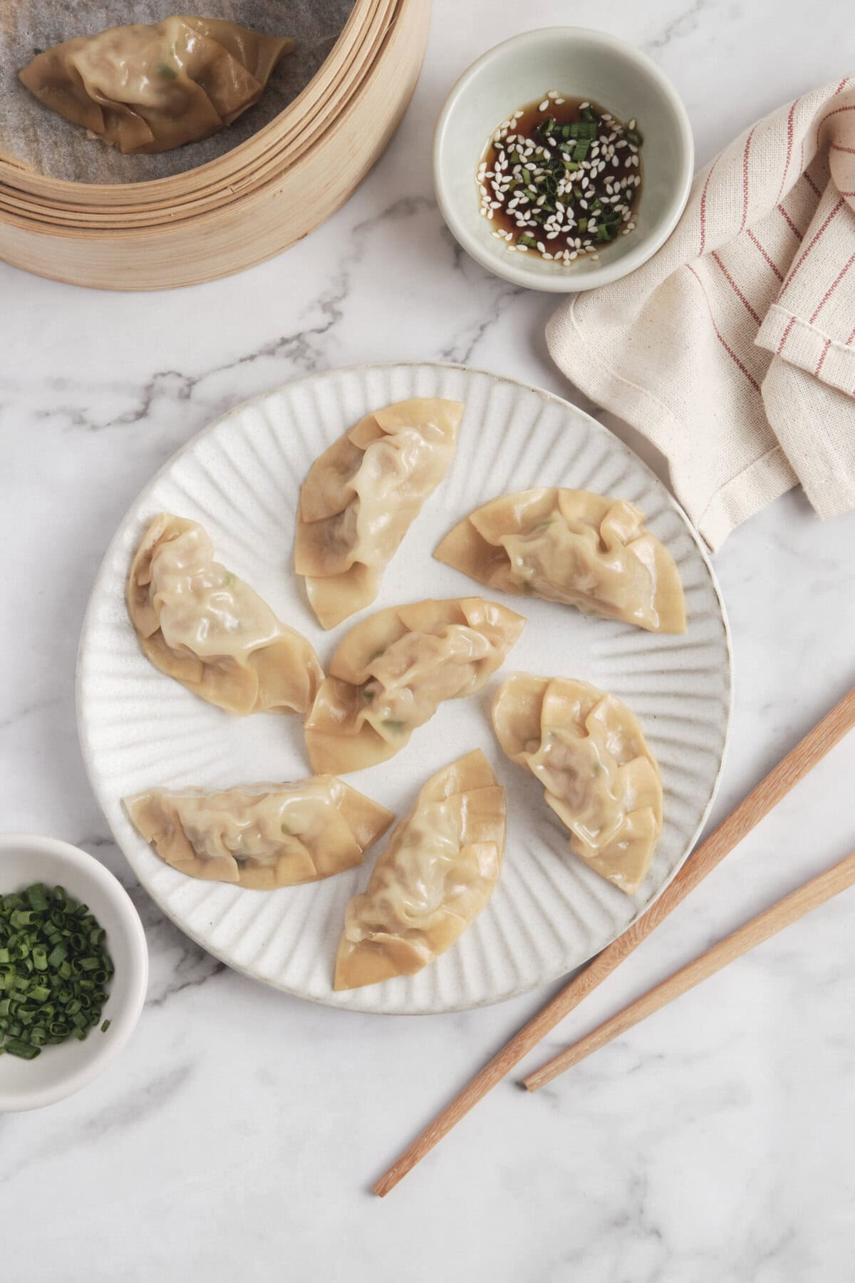 Delicious homemade vegetable dumplings served with dipping sauce on a white plate. Perfect for healthy, easy-to-make Asian-inspired recipes and nutritious meals.