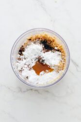 Ingredients for homemade chocolate peanut butter in a food processor, ready for blending.